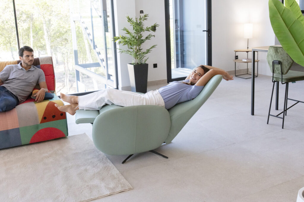 Blue swivel chair reclined